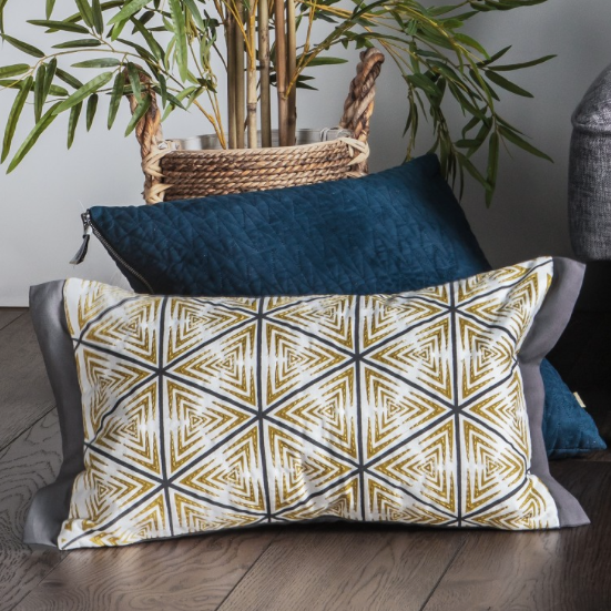 Luxury feather filled Scandi-inspired rectangular cushion in a contemporary yellow and grey palette. Sleek printed triangles are complimented by beautiful stitched detailing