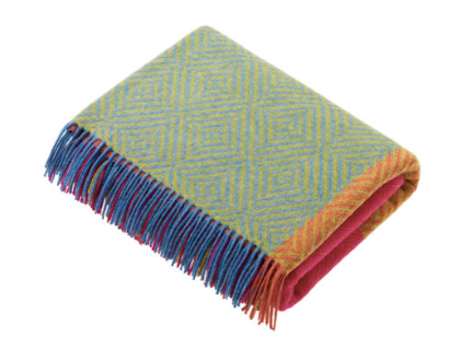 Our Block Harlequin is a multi-faceted design, with a large scale block check detailed with smaller scale patterns within each block such as twills, herringbones and diamonds. Made to be displayed unfurled over the bottom of a bed or full width of a sofa, these spectacular blankets are perfectly paired with our Bright Diamond throws